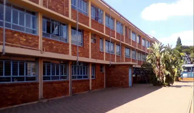 Three-storey red-brick classroom block at Allen Glen High School