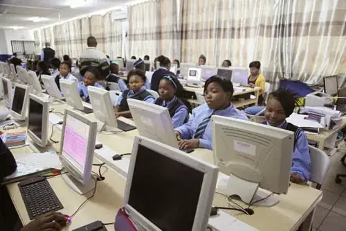 Learners working at computers in the Christian Progressive School computer lab in Pretoria