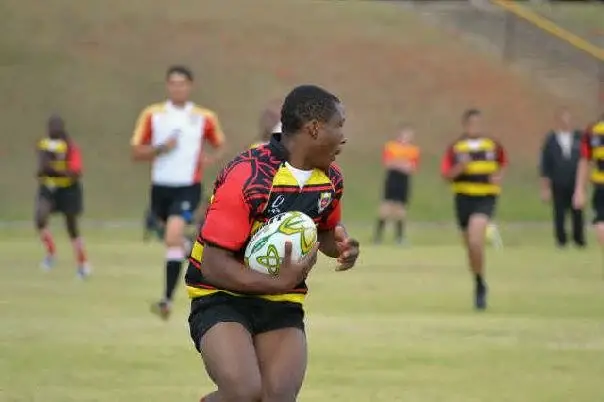 Florida Park High School rugby player running with the ball
