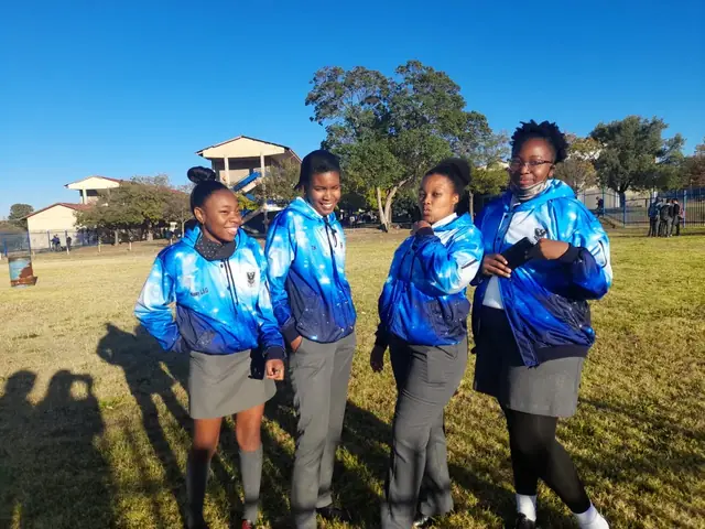 Hoërskool Die Adelaar learners in school tracksuit tops on the field