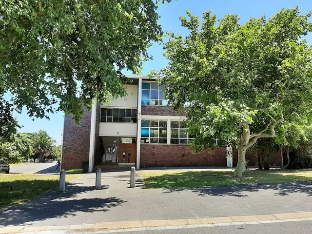 Rhodes High School building and trees
