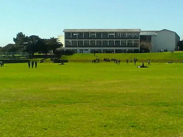 Rhodes High School sports field and classroom block
