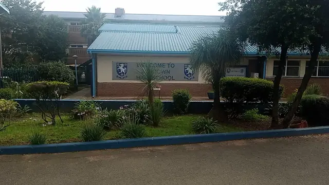 Sandown High School entrance building with welcome sign in Sandton
