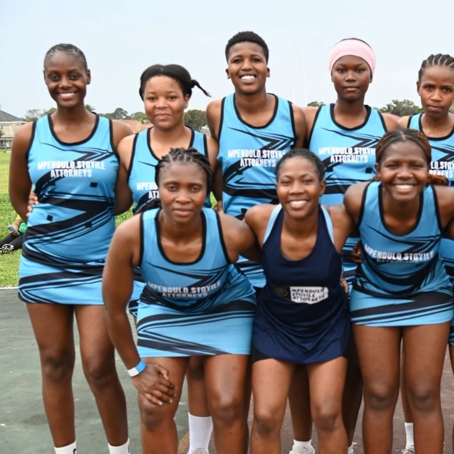 Ingwe TVET College Netball Team Group Photo Ingwe TVET College netball team posing together outdoors in sponsored light blue jerseys.