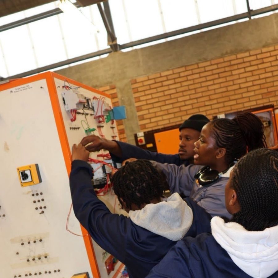 King Hintsa TVET College Students in Electrical Workshop King Hintsa TVET College students working together on an electrical training panel in a workshop.