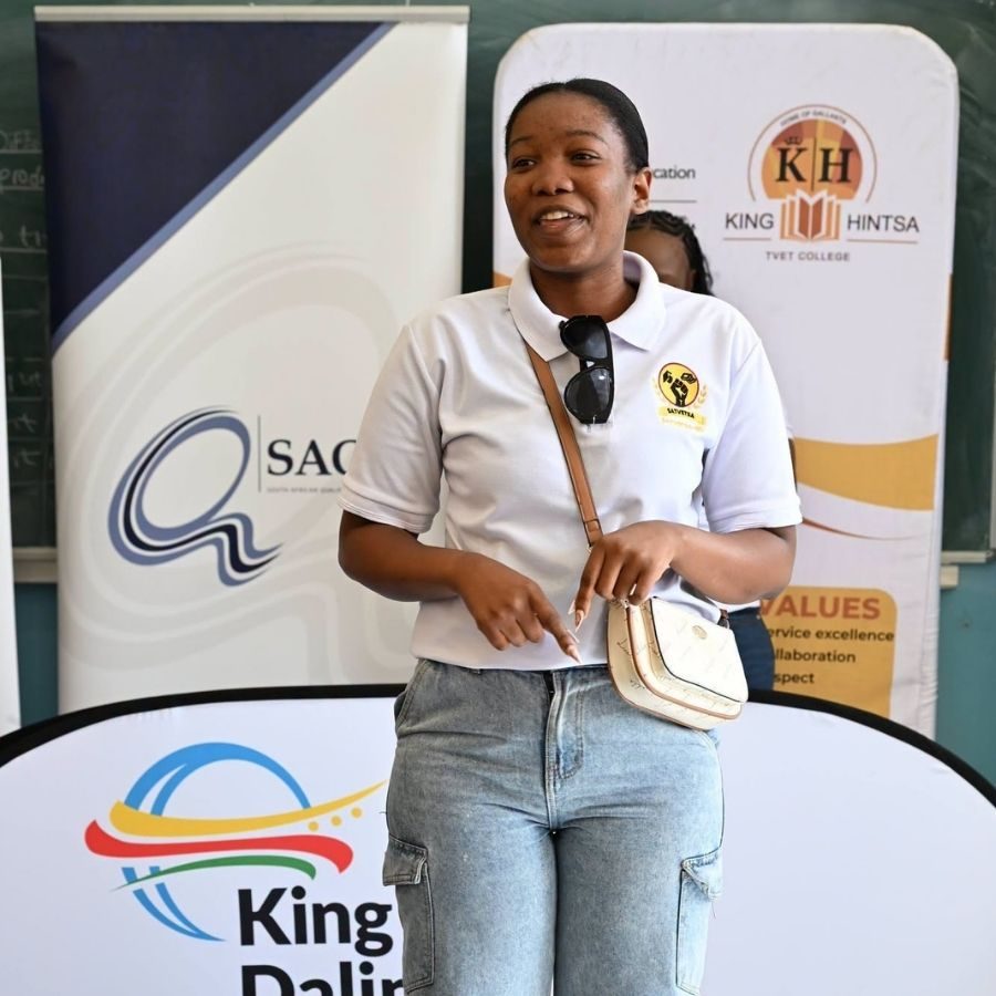 King Sabata Dalindyebo TVET College Speaker at Forum King Sabata Dalindyebo TVET College representative speaking in a classroom, with SAQA and King Hintsa banners behind her.