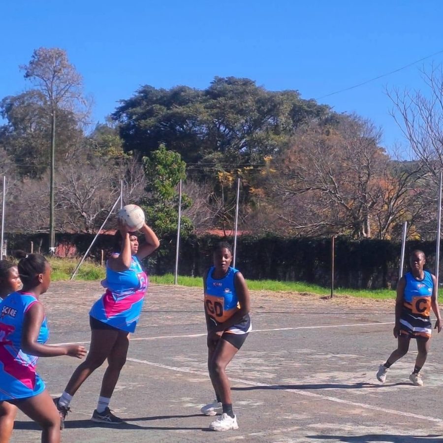 Lovedale TVET College Students Playing Netball Lovedale TVET College students in blue and orange bibs playing a netball match on an outdoor court