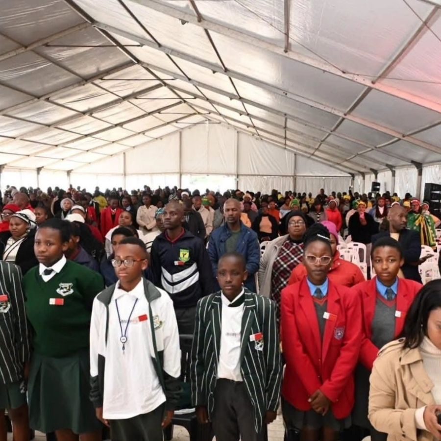 School Pupils in Uniform at Lovedale TVET College Assembly Rows of school pupils in various uniforms standing inside a large marquee tent at a Lovedale TVET College outreach event