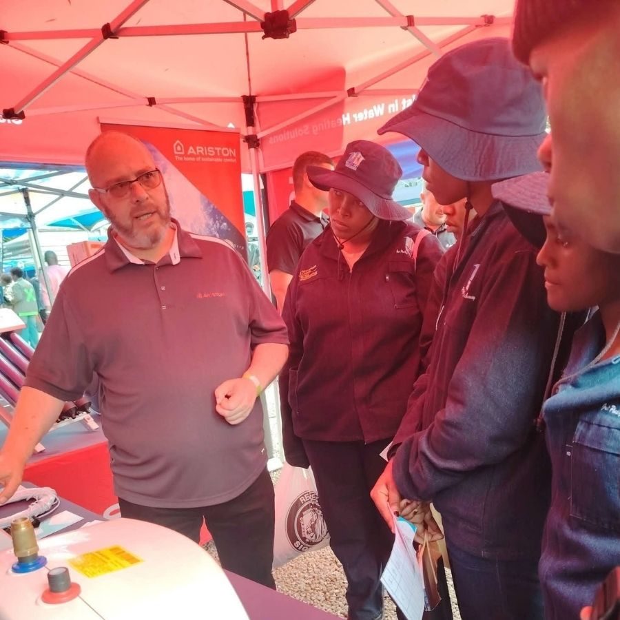 Maluti TVET College Students at Ariston Water Heating Stand Maluti TVET College students and staff listening to a presenter at an Ariston water heating solutions expo stand