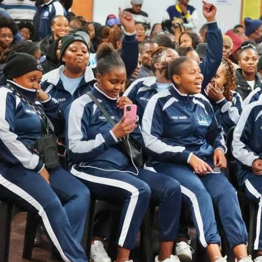 Mnambithi TVET College SRC 2026 Students Cheering in Crowd Mnambithi TVET College SRC 2026 students in matching navy and white tracksuits cheering in a crowd at a campus event