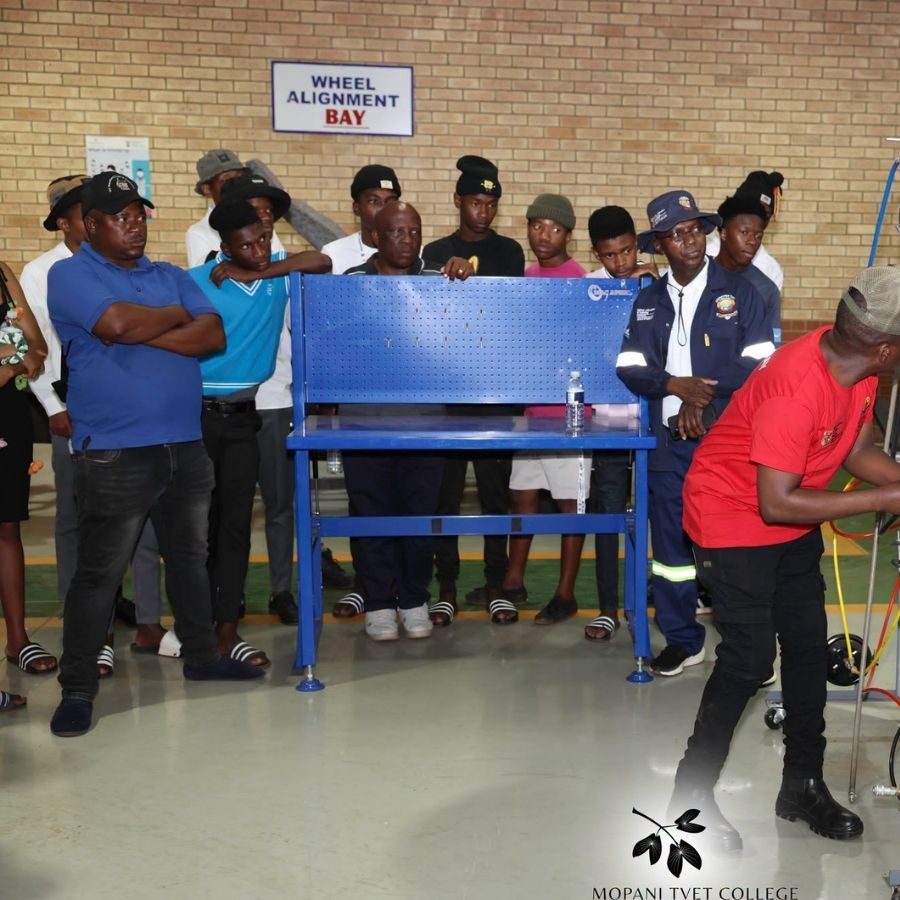 Students Observing Wheel Alignment Bay at Mopani South East TVET College Group of students and staff standing around equipment in the Wheel Alignment Bay workshop at Mopani South East TVET College