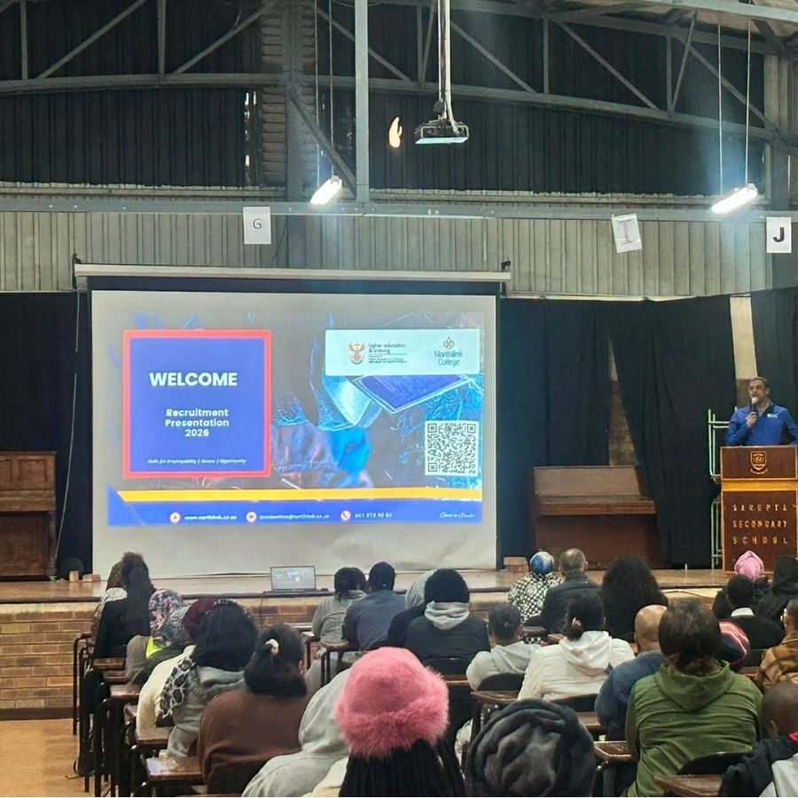 Northlink College Recruitment Presentation 2026 Audience watches a Northlink College Recruitment Presentation 2026 welcome slide at Sarepta Secondary School.