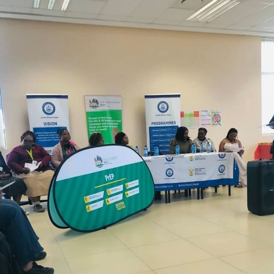 Umfolozi TVET College Health Awareness Panel Discussion Panel of speakers at Umfolozi TVET College during an HIV and TB health awareness campaign event featuring a PrEP banner