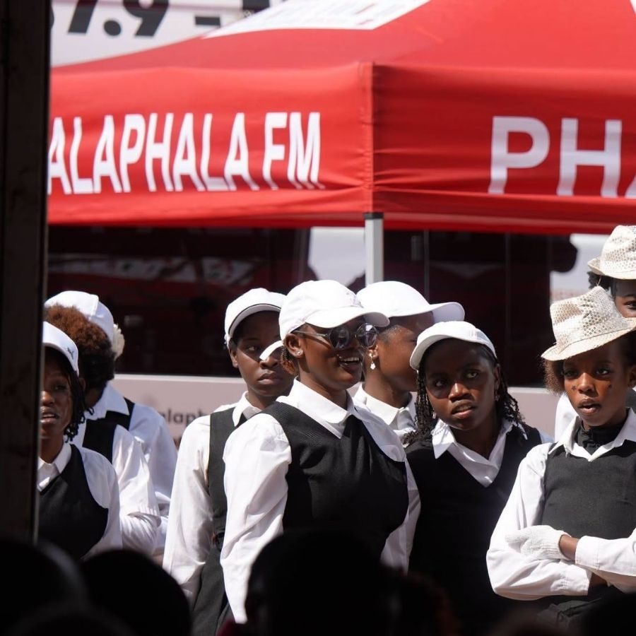 Vhembe TVET College Students at Phalaphala FM Outreach Vhembe TVET College students in black and white uniform standing under a Phalaphala FM tent at an outreach event